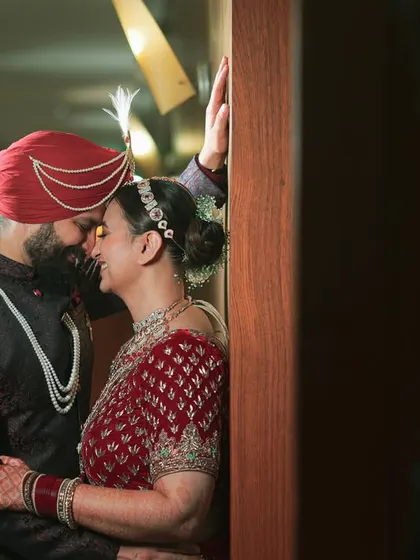 Love's blooming in every corner. An intimate, romantic portrait of a Sikh couple, their foreheads touching in a moment of quiet connection.