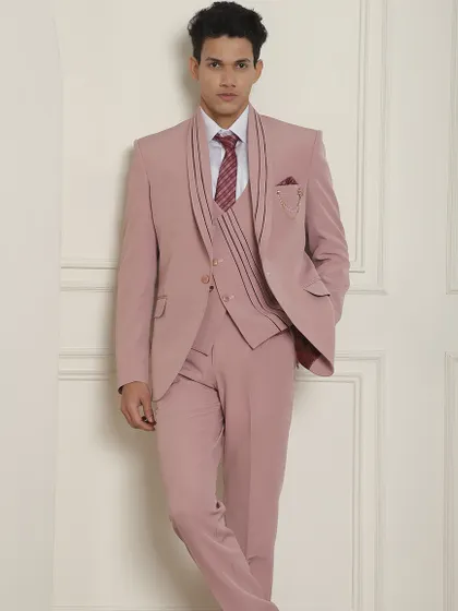 A full-length view of our unique pastel pink suit with distinctive lapel details.