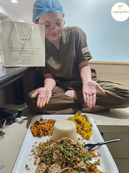A happy customer enjoying a platter of my snacks. Your satisfaction is my biggest reward.