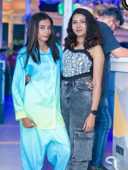Friends enjoying the rooftop party atmosphere at Hungry Hippie Bangalore.