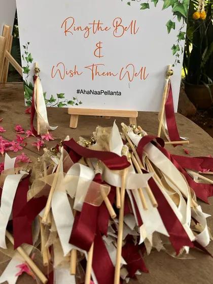 "Ring the Bell & Wish Them Well" wands for guests, a fun and interactive way to celebrate the couple.