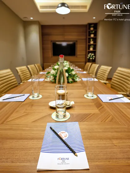 A close-up of the meeting essentials I provide. The custom-branded notepad and quality pen underscore the premium, detail-oriented service you can expect when hosting your business event with me.