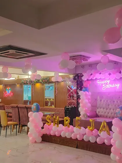 Another view of the pink and white first birthday party hall.