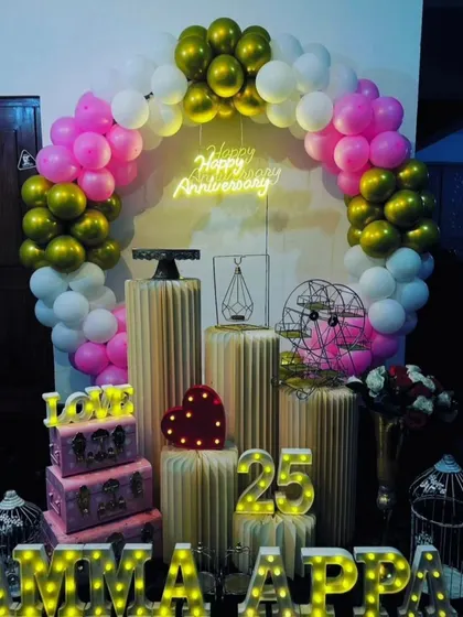 A heartfelt 25th anniversary celebration for 'Amma Appa'. The marquee letters add a personal touch to the beautiful balloon arch and decorative props.