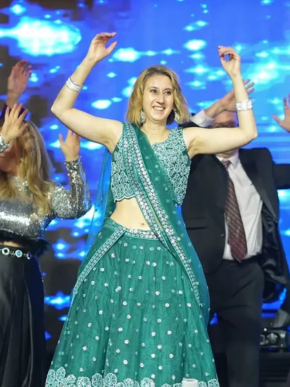 The joy on their faces is priceless. We make sure our choreography is easy to learn and fun for international guests who may be new to Indian dance.