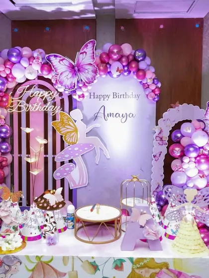 This butterfly garden theme for Amaya's birthday created a breathtaking, magical memory. The setup featured a beautiful arch of purple and pink balloons, fairy cutouts, and whimsical mushroom props for an enchanted celebration.
