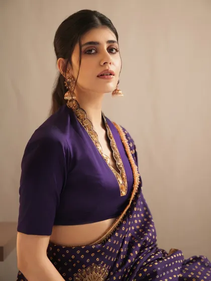 The lovely Sanjana Sanghi looking elegant in a purple saree, her look elevated by my gold temple-style jhumkas.