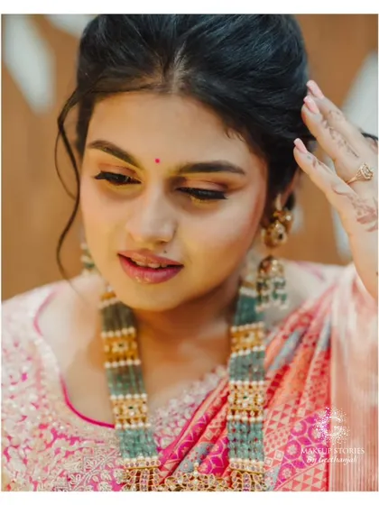 The beautiful Varsha. This close up shows a soft party makeup look with a focus on rosy cheeks and a gentle smokey eye.