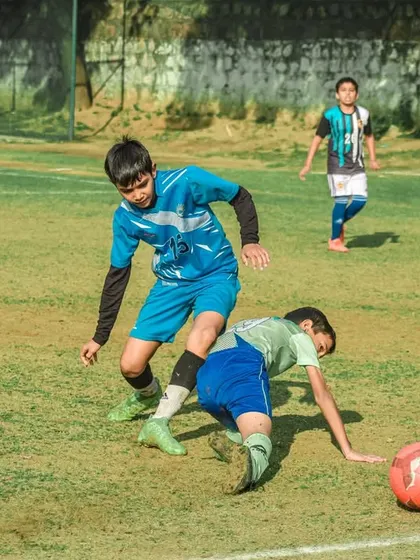 A dramatic slide tackle during a tense moment in the final match.