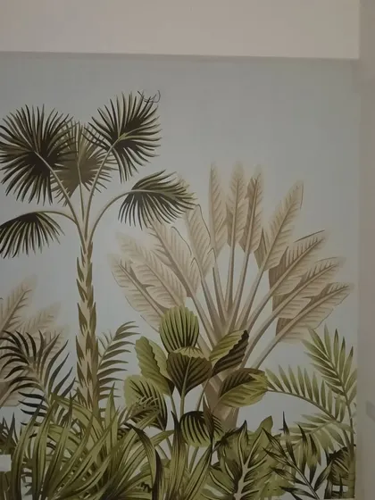 This tropical wallpaper features elegant palm and banana leaves, bringing a sophisticated and exotic feel to the room. The clean lines and muted colors make it a versatile choice for a modern interior.