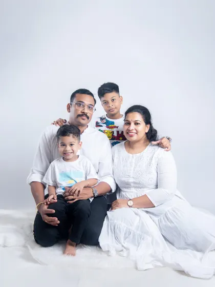 A classic family portrait taken in our bright and airy studio setup. We focus on creating a relaxed atmosphere where your family's natural joy and connection can shine, resulting in clean, timeless photographs.