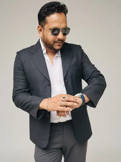 This dark pinstripe blazer is a classic choice for a mature and sophisticated look. It's perfect for formal dinners or important family gatherings.