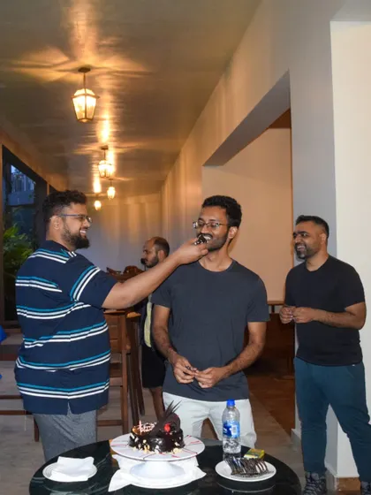 Celebrating personal milestones is part of building a great team. Here, we organized a surprise birthday cake cutting during a corporate offsite.