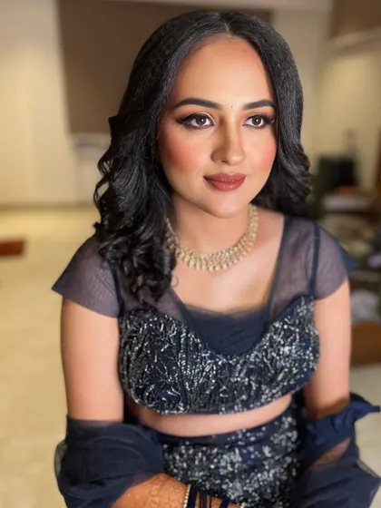 A forward-facing view of the soft glam reception makeup. The skin has a beautiful, healthy glow, and the lip color is a perfect nude that balances the look.