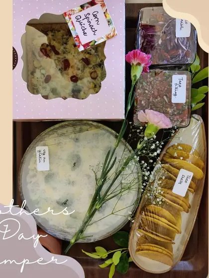 A thoughtful Mother's Day hamper featuring a delicious combination of our homemade Corn Spinach Quiche, Veg au Gratin, and crispy Taco Shells.