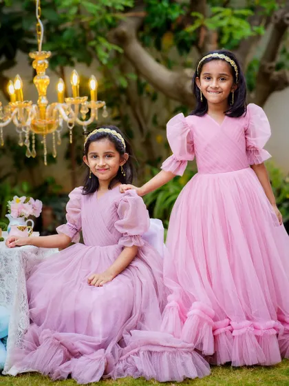 The special bond between sisters, captured during a beautiful outdoor tea party session. Dressed like princesses, they shared smiles and secrets, creating memories they will cherish for years to come.