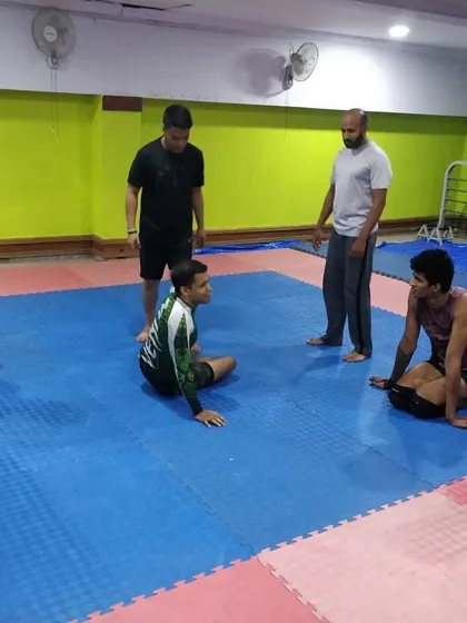 Another angle of Coach Sharmaji's visit, showing our students intently watching his demonstration. Learning from different perspectives is invaluable.