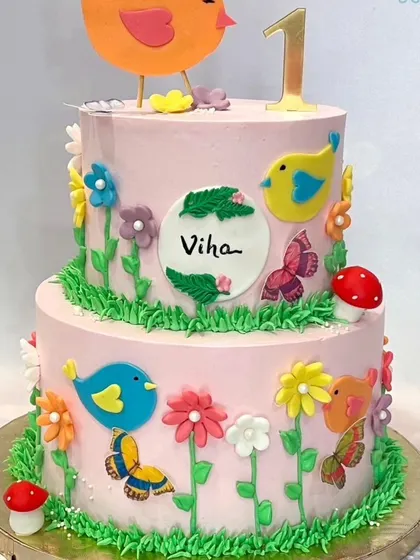 A collage from a brand feature, showcasing some of our favorite creations, including a two-tier bird-themed cake.