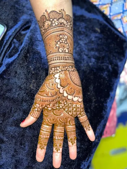 Look at the incredible progress. This intricate hand design, complete with a peacock motif, was created by a student after taking my course, showcasing their newfound skill in detailed work.