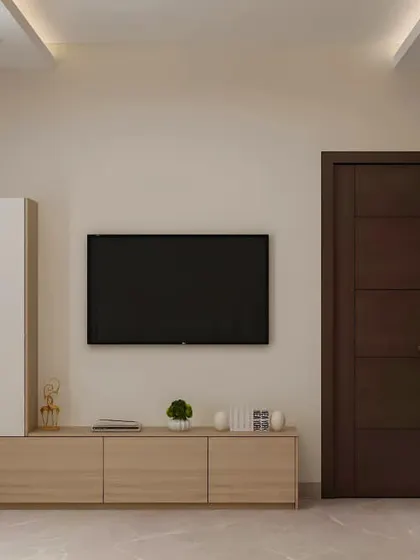 A practical and stylish TV unit for a compact space, combining a low media console with an attached tall cabinet. The mix of light wood and white finishes keeps the design feeling bright and open.