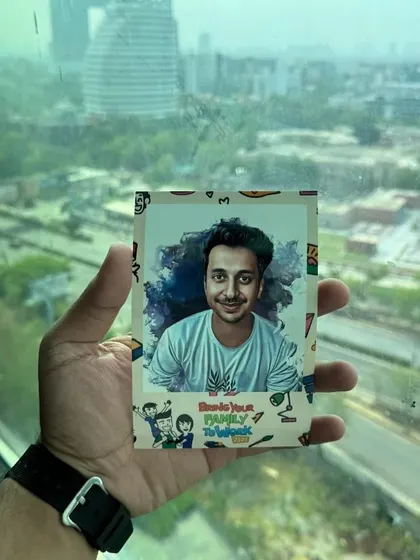 This digital caricature, created for a corporate family day, is held against a city skyline, showcasing the portability and on-site nature of our service. We bring the entire studio experience to your event location.