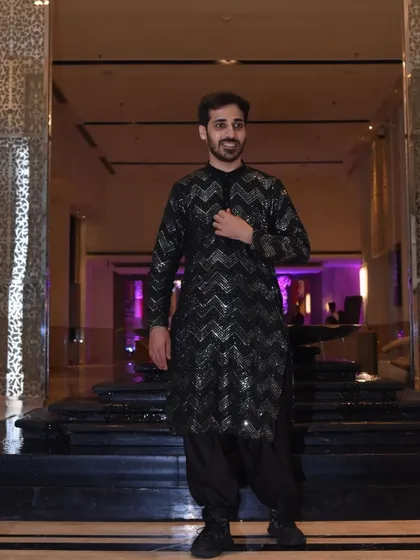 The full look for the brother of the bride. The modern, tailored kurta paired with stylish shoes creates a contemporary ethnic look perfect for a sangeet or cocktail party.