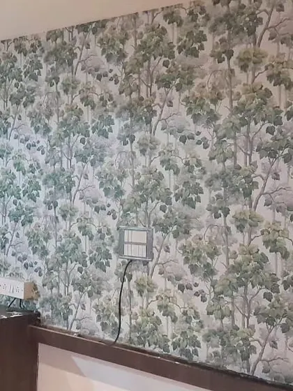 A close-up of the green forest wallpaper, showing the detail in the tree and leaf illustrations.