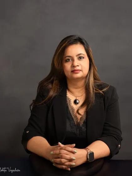 A classic, powerful headshot. The dark blazer and direct gaze convey confidence and expertise, making this a strong choice for a corporate leader or entrepreneur.