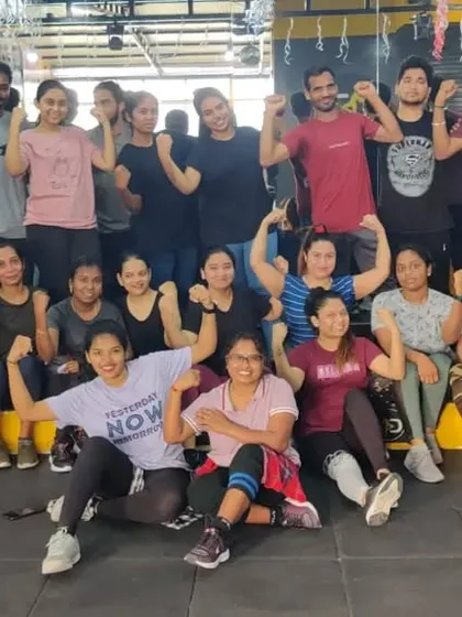 Flexing after a powerful Zumba session. This is what building strength together looks like.