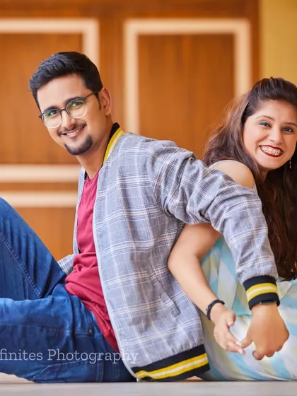 A simple, happy, and connected back-to-back pose that beautifully captures the joy and friendship in your relationship.