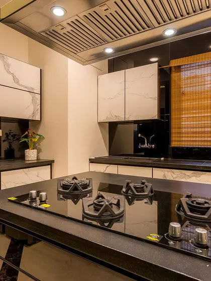 A detailed shot of the hob integrated into the kitchen island, showcasing the sleek, modern design and high-end appliances we use.