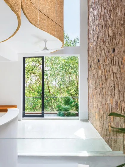 A feature photo from a magazine spread, highlighting the project's goal of creating a residence where animals and plants are as welcome as people.