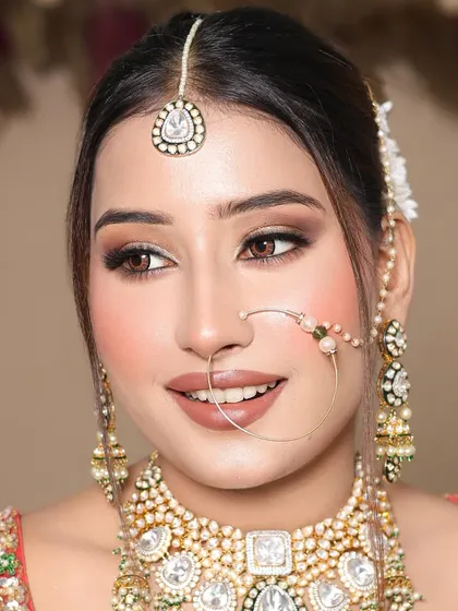 A smiling shot that shows how the makeup looks natural and not heavy, even with full coverage.