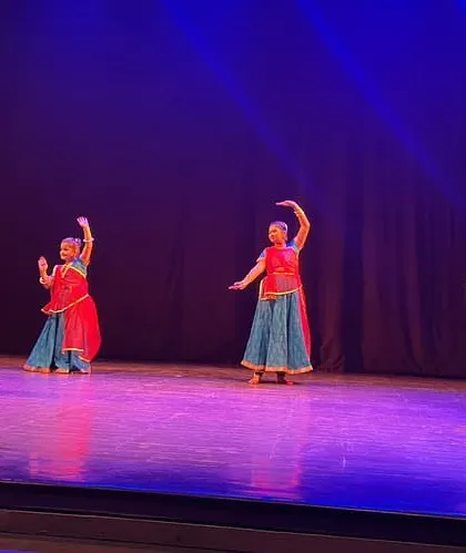 A dynamic shot of our Kathak students during the 'Sarvaang 2023' event. The stage lighting and professional setting give our students a true taste of being a performing artist.