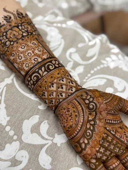 This is a detailed view of my intricate bridal henna work. Each design is unique, combining traditional patterns like paisleys and mandalas with fine-line fillers to create a stunning, full-coverage look for your special day.