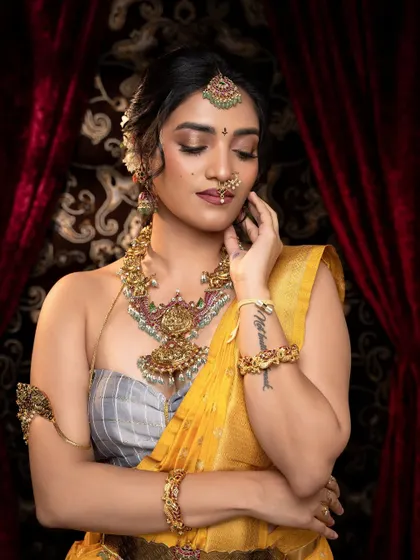 A thoughtful pose showing the full set of jewellery, including the bracelets and rings, all part of my customizable rental packages.