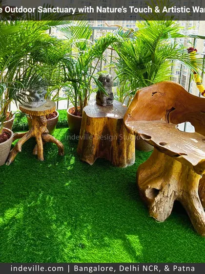 This balcony is a sanctuary of art and nature. I used unique, handcrafted wooden furniture, including a sculptural chair and root-like side tables, on a bed of artificial grass surrounded by lush plants to create a truly artistic corner.
