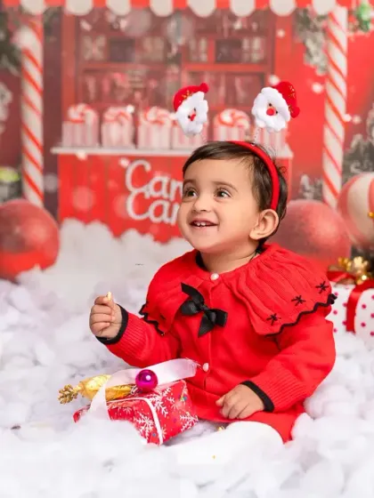 Feeling the magic of Christmas in our winter wonderland studio setup. This festive toddler portrait captures the wonder of the holiday season.