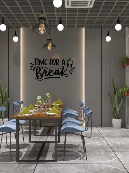 For this factory office cafeteria, we used a bold and modern design. The space features a mix of terrazzo, a striking blue and red color scheme, and an industrial grid ceiling to create a vibrant and energetic place for employees to relax.