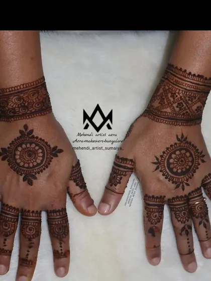 A simple and elegant mandala design, a popular choice for Karva Chauth for those who prefer a minimalist style.