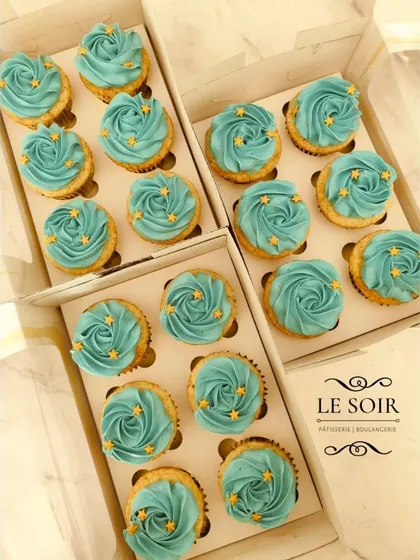 Simple, elegant, and perfect for a large event. These are classic vanilla cupcakes topped with beautiful teal buttercream rosettes and a sprinkle of tiny gold stars for a celestial touch.