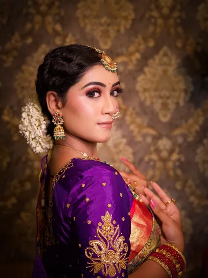 A classic portrait pose. The makeup is timeless and elegant, ensuring these photos will be cherished for years to come.