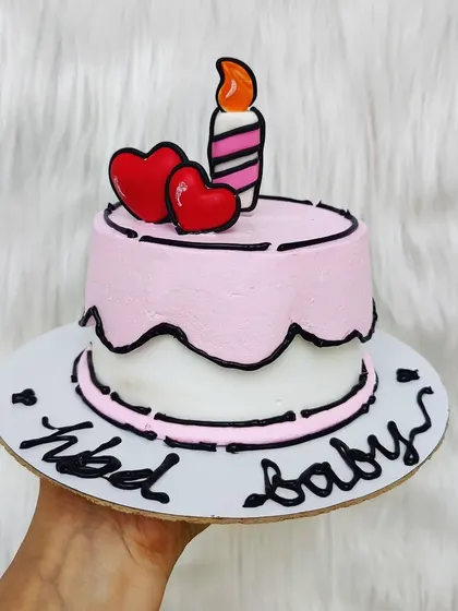 A pink comic cake with little red hearts. It's a sweet and playful take on the trendy cartoon cake style.