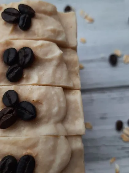 This stack of Scrubby Coffee soaps shows the creamy, oat milk-infused top layer. This soap provides a vigorous scrub that leaves your skin feeling incredibly smooth.