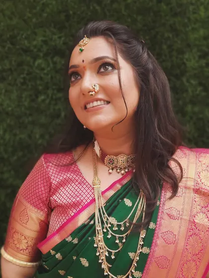 A beautiful upward glance from the bride. The makeup highlights her eyes, and the multi-layered necklace adds a touch of grandeur to her engagement look.
