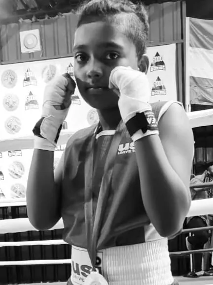 A portrait of a young, determined boxer from our club. We are proud to be shaping the next generation of champions.