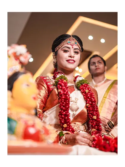 A lovely portrait of the bride during the wedding ceremony, her expression a mix of joy and solemnity.