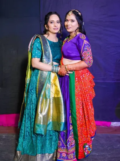 Another pair of happy clients ready for a celebration. Their makeup is designed to complement their beautiful traditional wear.