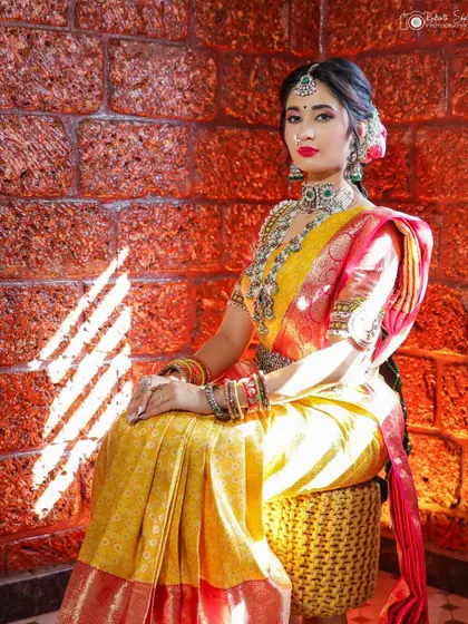 Using natural light to create drama. Here, a sliver of sunlight falls across the model in her traditional attire, creating a beautiful, artistic effect against the rustic brick wall.
