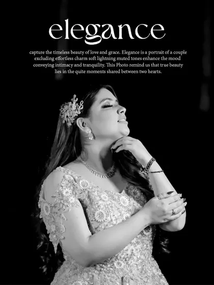 A black and white portrait of bride Karishma, her elegant pose and gown highlighted by soft lighting.